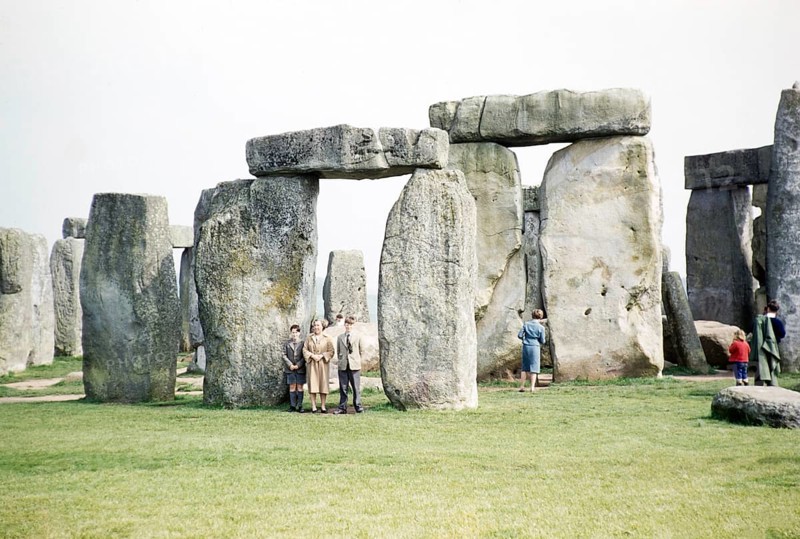 People exploring the standing stones at the Neolithic site of Stonehenge, Wiltshire, England, UK 1961