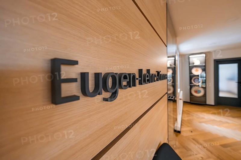 Modern hallway with wooden wall and the lettering 'Lehre-Zimmer', behind it a seating area, Nagold Town Hall, Black Forest, Germany, Europe