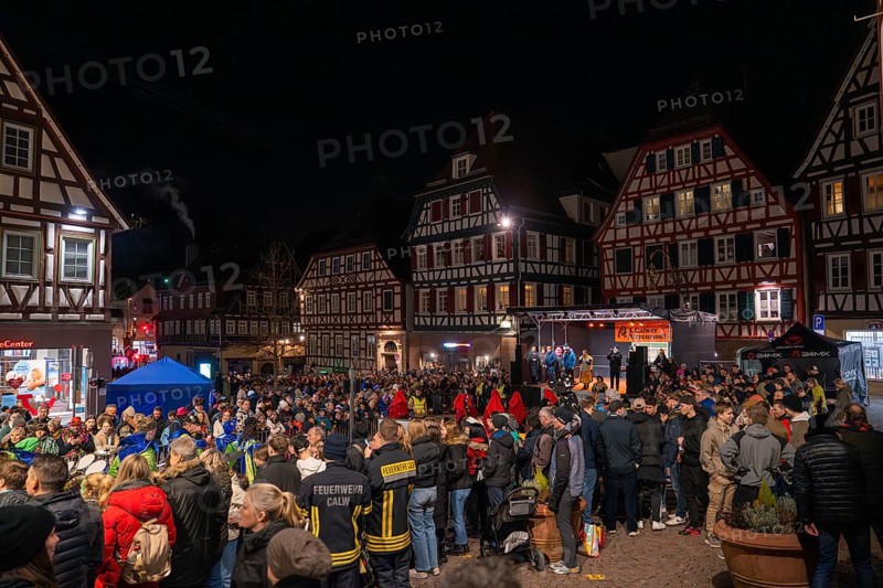 Large crowd gathers at night for a celebration in front of half-timbered houses, carnival, Calw, Black Forest, district of Calw, Germany, Europe