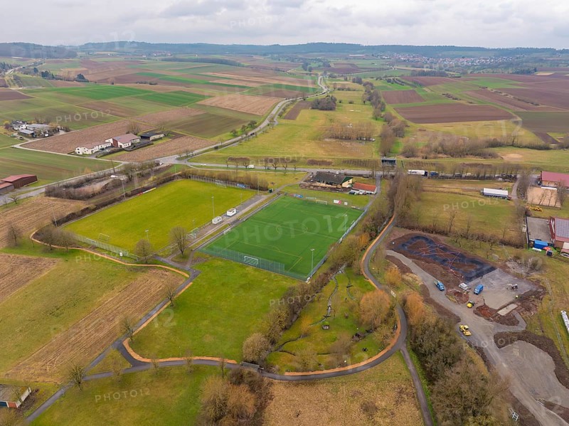 Green sports field surrounded by fields and scattered trees in a rural setting, Großbottwar, Ludwigsburg district, Baden-Württemberg, Germany, Europe