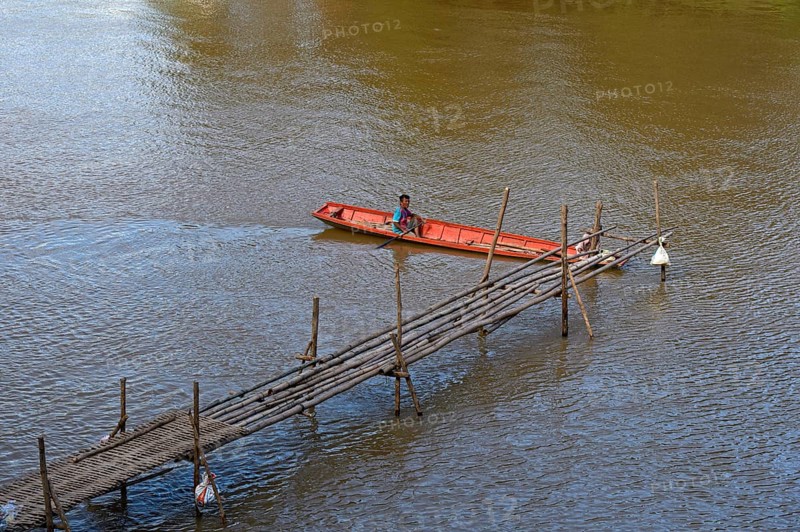 Red boat on a bamboo jetty on the Mekong, Luang Prabang, Laos, Asia
