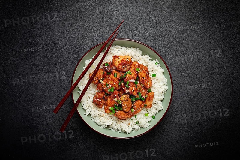 Fried chicken teriyaki with rice, green onion and sesame, homemade, no people