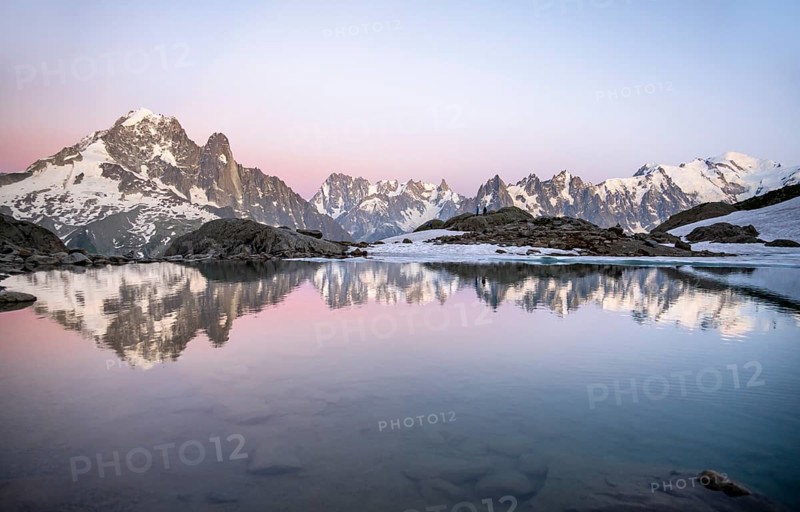 Evening mood, mountain landscape at sunset, water reflection in Lac Blanc, mountain peak, Aiguille Verte, Grandes Jorasses, Aiguille du Moine, Mont Blanc, Mont Blanc massif, Chamonix-Mont-Blanc, Haute-Savoie, France, Europe
