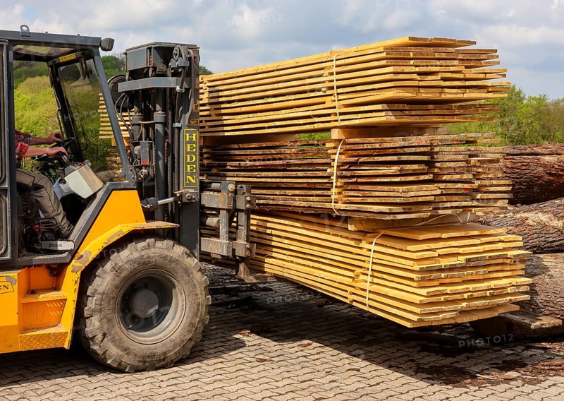 Solingen, North Rhine-Westphalia, Germany - Spruce logs are processed into construction timber, construction timber is scarce and expensive, carpentry and joinery companies are struggling with rapidly rising raw timber prices in times of the corona crisis, and large quantities of logs are exported to China and the USA