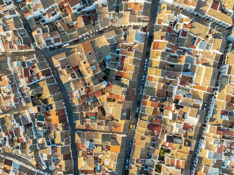 Streets and rooftops in the White Town of Olvera. Aerial view. Drone shot. Cádiz province, Andalusia, Spain, Europe