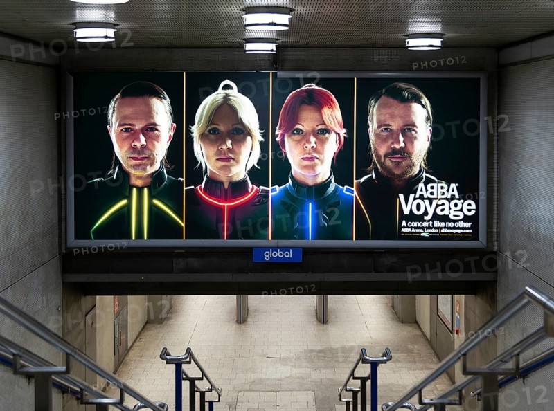 Electronic advertising poster hologram faces pop group Abba promoting Abba Voyage concert, London, England, UK