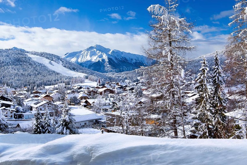View of the village with Gschwandkopf and Hocheder 2797m in winter, Seefeld, Seefeld Plateau, Tyrol, Austria, Europe