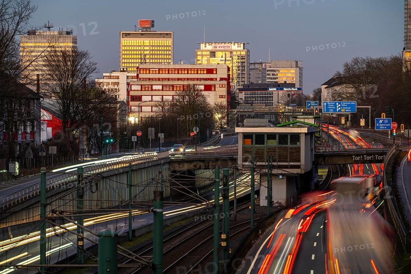 Motorway A40, Ruhr expressway, heavy traffic jam, rush hour, city passage in Essen, skyline of the city centre, underground line between the lanes, Hobeisenbrücke stop, North Rhine-Westphalia, Germany, Europe