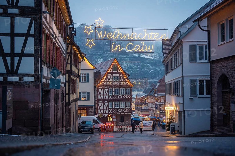 Christmas-lit street with half-timbered houses and wintry backdrop, Calw Christmas market, Black Forest, Germany, Europe
