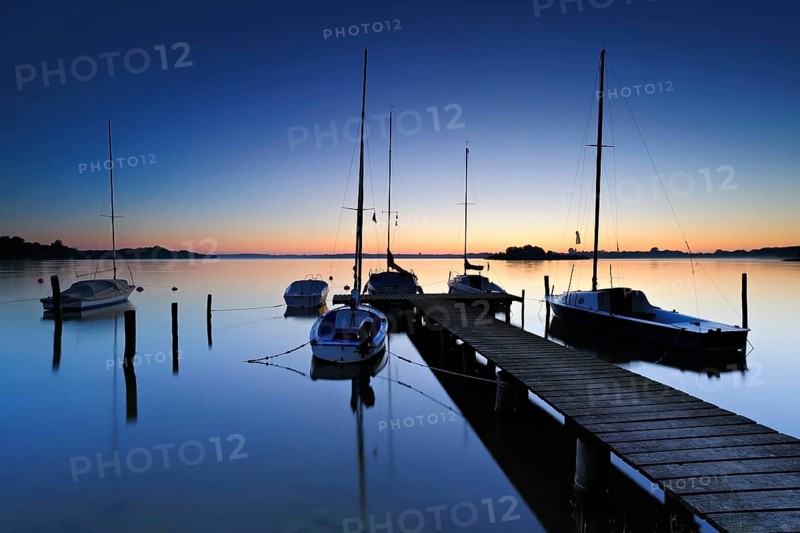 Dawn on the Schaalsee, wooden jetty with sailing boats, Schaalsee Biosphere Reserve, Mecklenburg-Western Pomerania, Germany, Europe