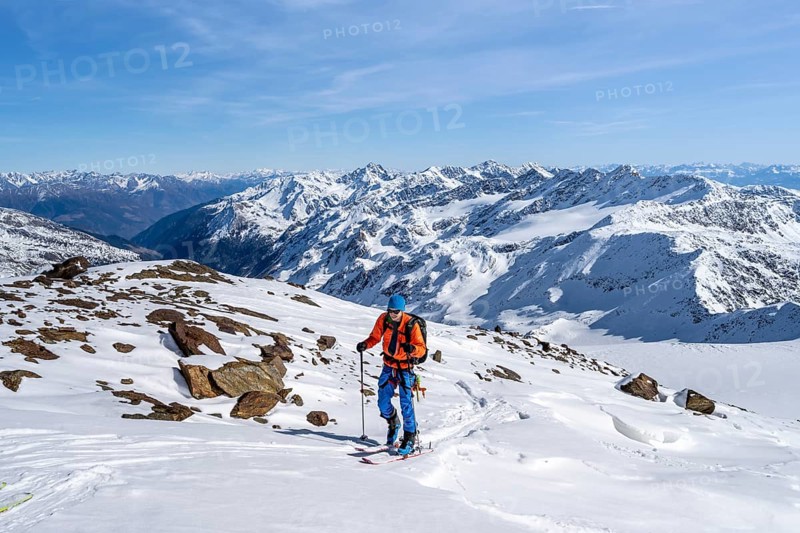 Ski tourers on a high tour on the Fürkeleferner glacier, view of the mountain panorama, snow-covered mountain landscape in winter, ascent to Monte Cevedale, Ortler Alps, Vinschgau Valley, Italy, Europe