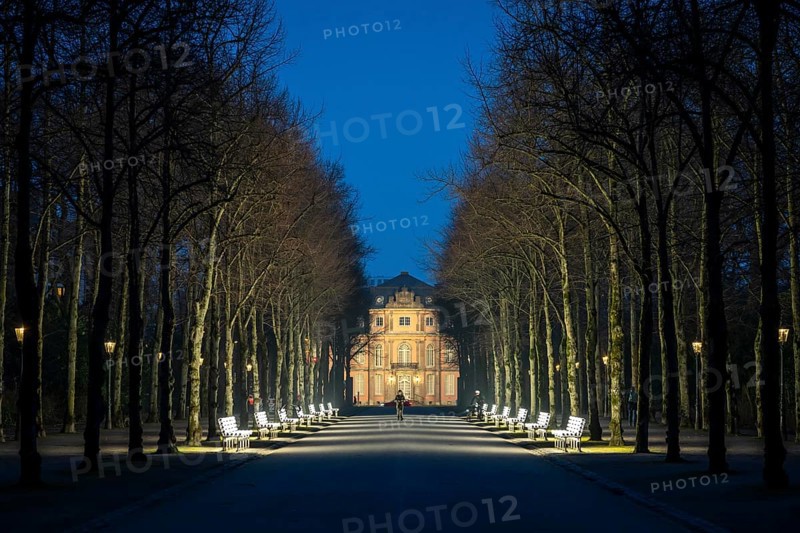 The light benches by artist Stefan Sous in the Hofgarten, entitled UV-A UV-B, 14 completely refurbished exhibits from the 2002 light-grey art exhibition, which now stand and light up as a permanent work of art on Jägerhofallee, LED technology, in the background Jägerhof Palace, home of the Goethe Museum, Düsseldorf, North Rhine-Westphalia, Germany, Europe