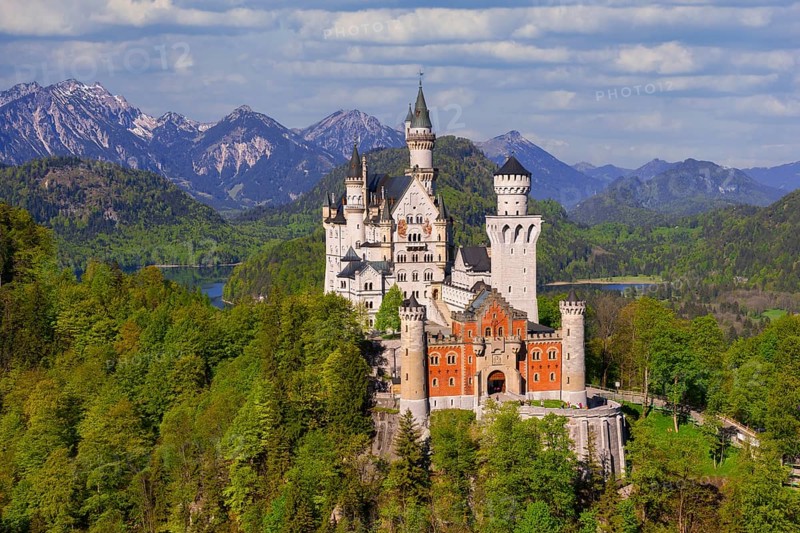 Neuschwanstein Castle with majestic Alpine peaks in the background, shrouded in clouds, Schwangau, Ostallgäu, Allgäu, Swabia, Upper Bavaria, Bavaria, Germany, Europe