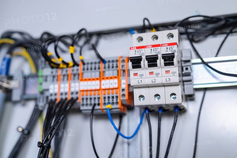 Close-up of circuit-breakers and cables in an electrical system, showing precision in the arrangement of components, switch cabinet construction, PV system construction, major customer, Enzkreis, Germany, Europe