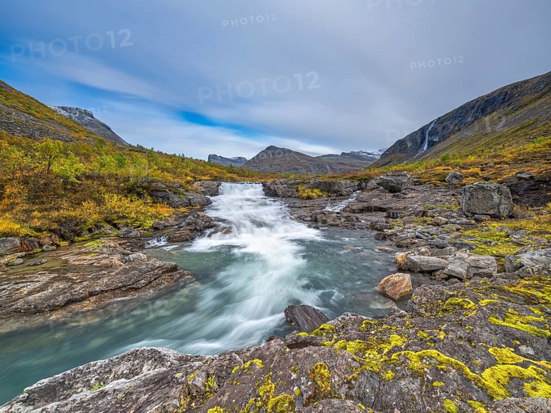 Autumn in Reinheimen National Park, mountains with river in Valldalen valley, Stigbotthornet mountain, Møre og Romsdal, Norway, Europe