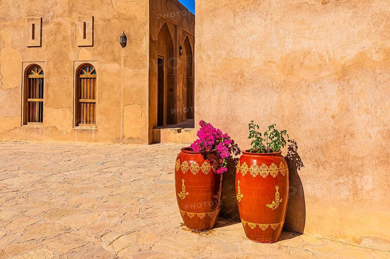 An inner courtyard of the palace fortress of Jabrin, decorated with large flower vases, Jabrin, near the city of Bahla, Arabian Peninsula, Sultanate of Oman
