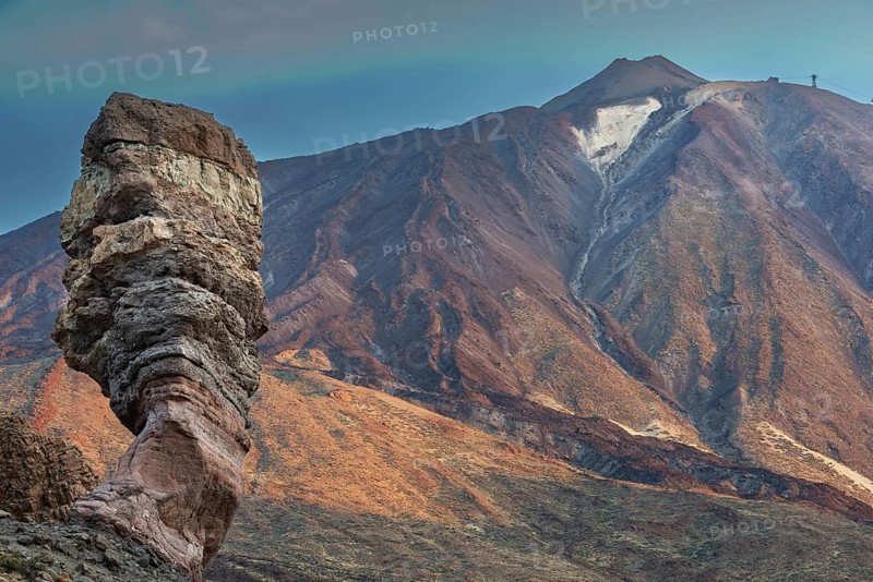 Panorama at sunrise on the Roque Chinchado, also known as the Stone Tree or Finger of God, landmark of the island, Los Roques de Garcia, behind it the Pico del Teide, 3717m, Las Cañadas, Teide National Park, Tenerife, Canary Islands, Spain, Europe