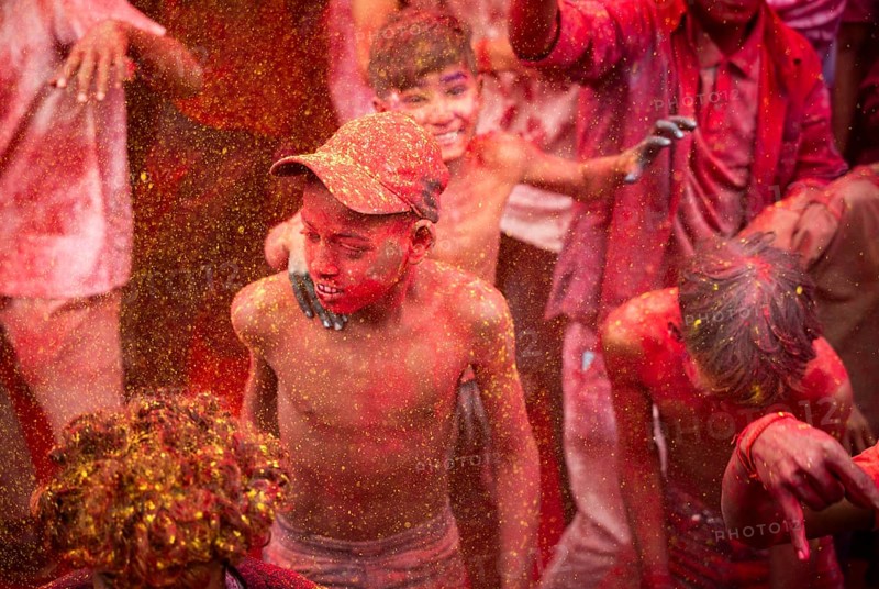 Revellers smear with Gulal or coloured powder and dance to play Holi, the Hindu spring festival of colours, on March 14, 2025 in Guwahati, India, Asia