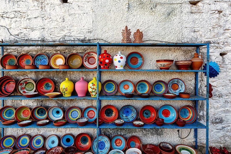 Colourful ceramics, outdoor shelf, pottery, souvenir shop in the village of Pyrgos Dirou, Mani, Greece, Europe