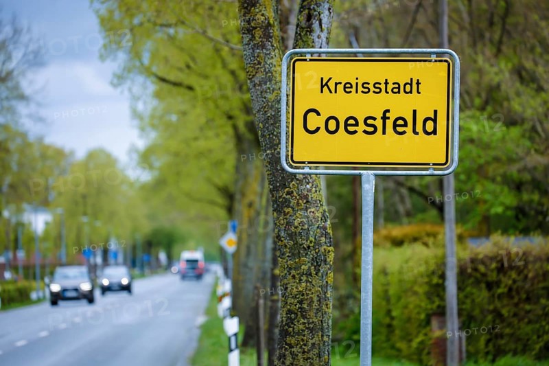 Coesfeld, North Rhine-Westphalia, Germany - Place name sign in times of the corona pandemic, Coesfeld district starts as a model region in North Rhine-Westphalia with relaxations