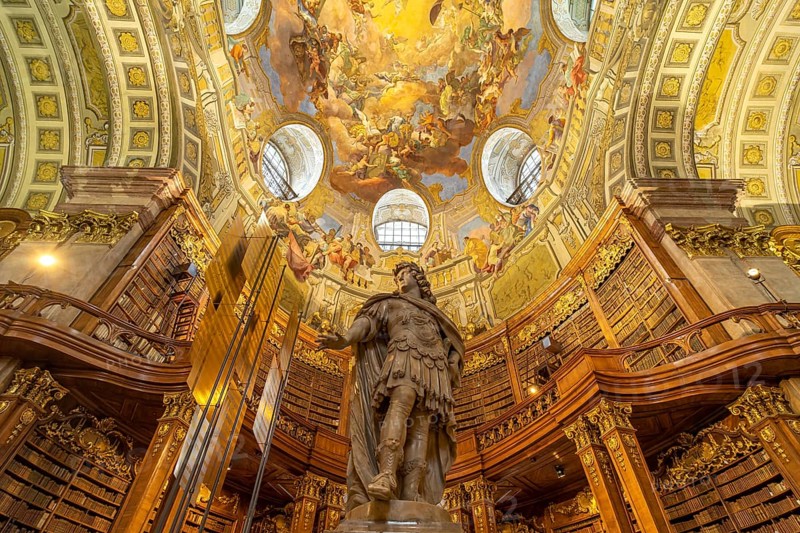Statue of Emperor Charles VI by Peter and Paul Strudel, State Hall of the Austrian National Library in Vienna, Austria, Europe