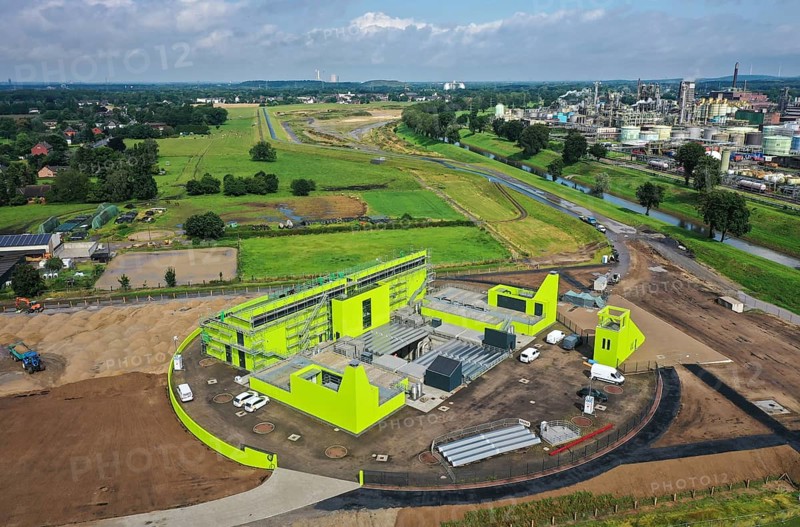 Oberhausen, North Rhine-Westphalia, Germany - Emscher conversion, new Emscher AKE sewer, here the new Oberhausen pumping station, Germany's largest wastewater pumping station, uses 10 pumps to pump up to 16, 500 litres of wastewater per second from a depth of around 40 metres. At the back, new floodplains for better flood protection. At the back right, OQ Chemicals plant Ruhrchemie. The ecological conversion of the Emscher system consists of the construction of a central wastewater treatment system in the Ruhr area, the construction of sewers and the renaturalisation of the Emscher and its tributaries