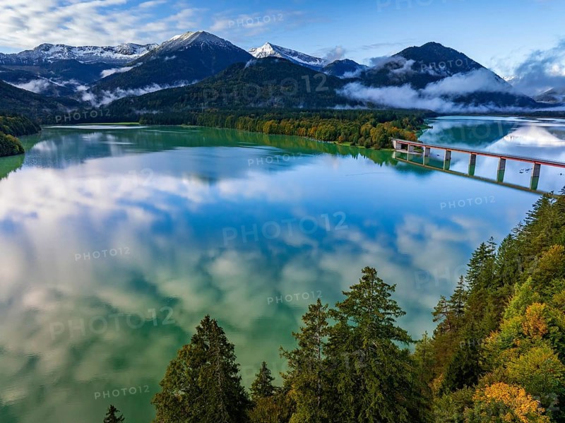 Snow-covered mountains reflected in lake, sunny, bridge, autumn, Sylvensteinsee, Karwendel Mountains, Bavaria, Germany, Europe