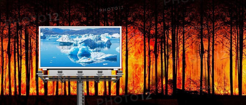 Symbolic image, forest fire, billboard with icebergs and polar bear, threat to paradise, water shortage, water emergency, global drought, climate crisis, climate change, climate change, famine, melting glaciers, warming, global warming, rising sea levels, Donald Trump president, US withdrawal from climate agreement