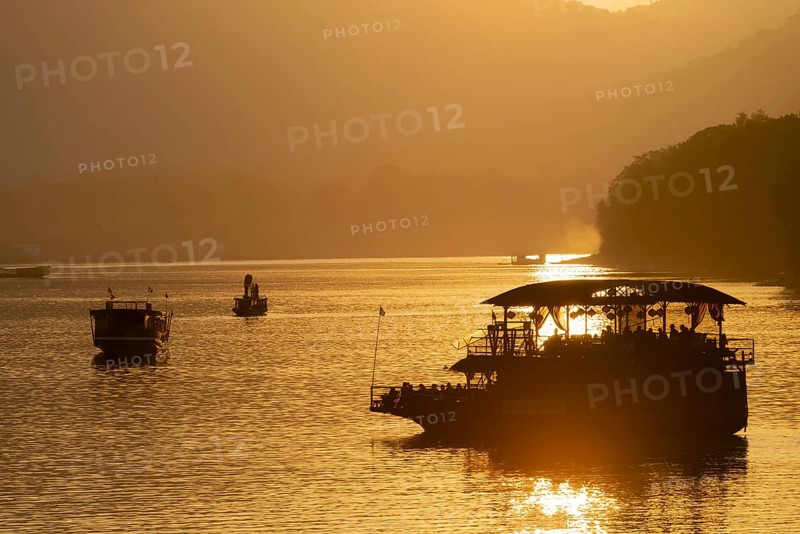 Sunset on the Mekong with excursion boats, near Luang Prabang, Laos, Asia