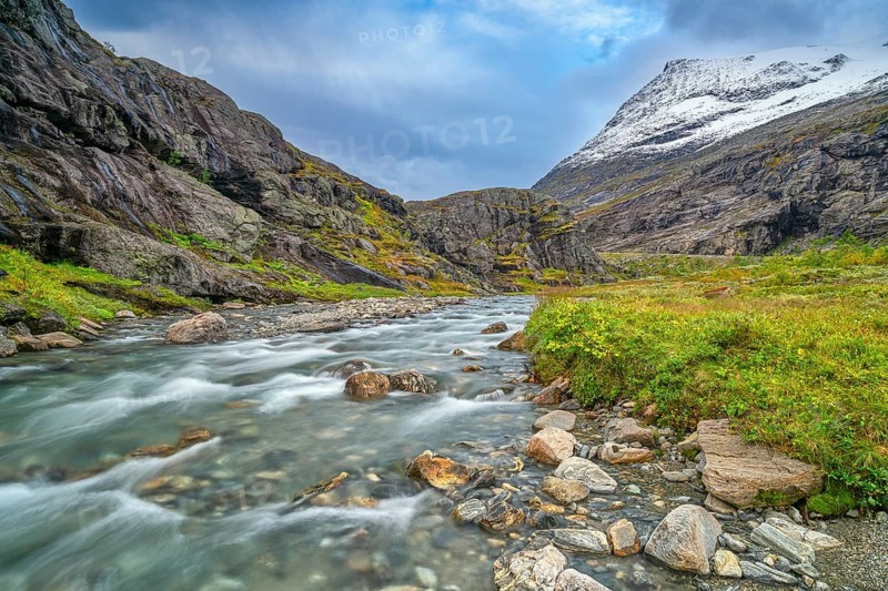 Mountain stream at Trollstigen, snow-covered mountain in the background, Alnestinden, Åndalsnes, Møre og Romsdal, Norway, Europe