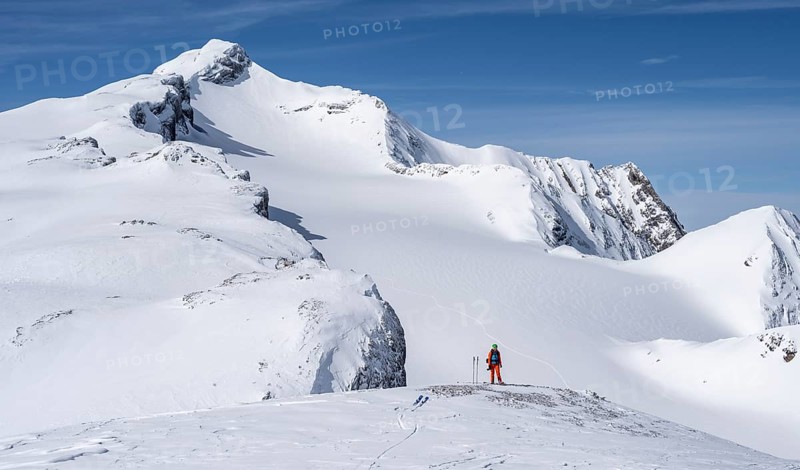 Ski tourers in front of a snow-covered mountain landscape, Wildhorn in winter, Bernese Alps, Bernese Oberland, Switzerland, Europe