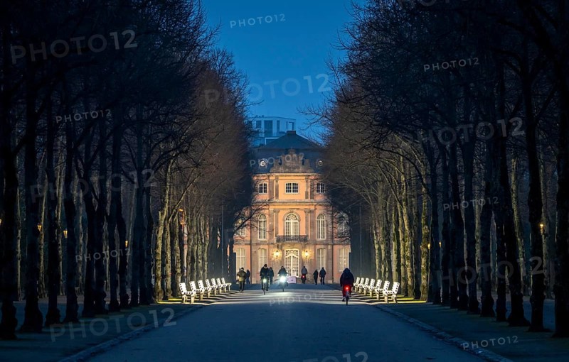 The light benches by artist Stefan Sous in the Hofgarten, entitled UV-A UV-B, 14 completely refurbished exhibits from the 2002 light-grey art exhibition, which now stand and light up as a permanent work of art on Jägerhofallee, LED technology, in the background Jägerhof Palace, home of the Goethe Museum, Düsseldorf, North Rhine-Westphalia, Germany, Europe