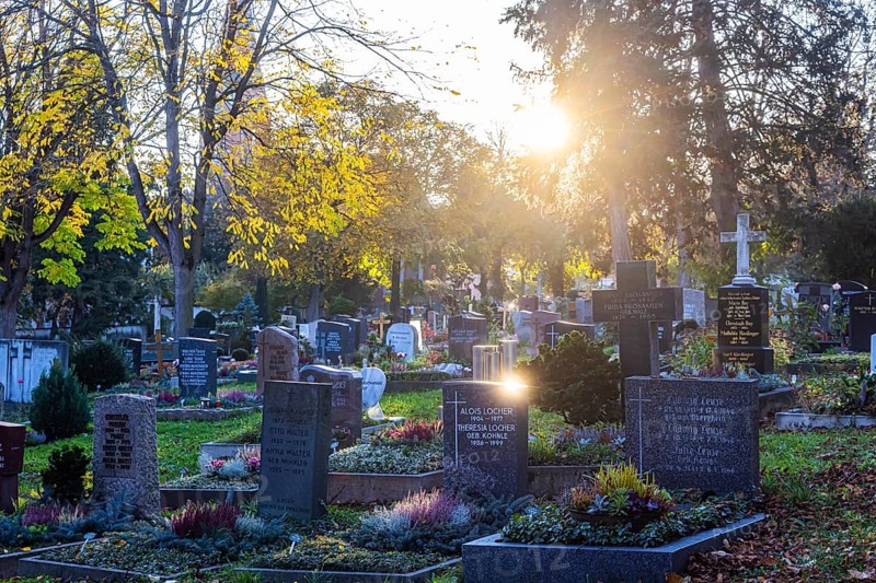 All Saints' Day at the Bergfriedhof cemetery in Stuttgart. Catholics commemorate their deceased relatives. Grave decorations and candles. Stuttgart, Baden-Württemberg, Germany, Europe