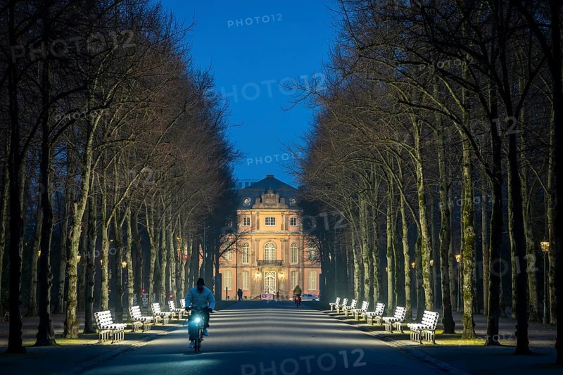 The light benches by artist Stefan Sous in the Hofgarten, entitled UV-A UV-B, 14 completely refurbished exhibits from the 2002 light-grey art exhibition, which now stand and light up as a permanent work of art on Jägerhofallee, LED technology, in the background Jägerhof Palace, home of the Goethe Museum, Düsseldorf, North Rhine-Westphalia, Germany, Europe