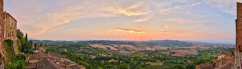 View from Montepulciano into a typical Tuscan landscape in Val d'Orcia with hills, trees, fields, cypresses and farm houses in summer, Montepulciano, Tuscany, Italy, Europe