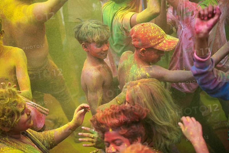 Revellers smear with Gulal or coloured powder and dance to play Holi, the Hindu spring festival of colours, on March 14, 2025 in Guwahati, India, Asia