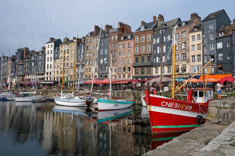 Honfleur, Normandy, France - Boats on the Quai Sainte-Catherine in the old harbour, Vieux Bassin, in the picturesque harbour town of Honfleur at the mouth of the Seine