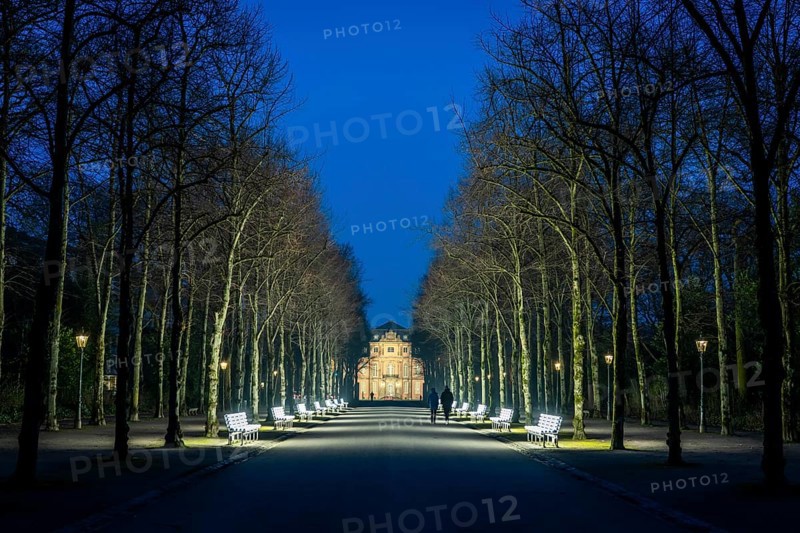 The light benches by artist Stefan Sous in the Hofgarten, entitled UV-A UV-B, 14 completely refurbished exhibits from the 2002 light-grey art exhibition, which now stand and light up as a permanent work of art on Jägerhofallee, LED technology, in the background Jägerhof Palace, home of the Goethe Museum, Düsseldorf, North Rhine-Westphalia, Germany, Europe