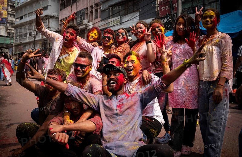 Revellers smear with Gulal or coloured powder and dance to play Holi, the Hindu spring festival of colours, on March 14, 2025 in Guwahati, India, Asia