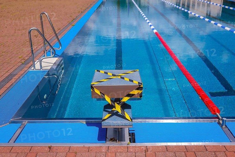 Hagen, North Rhine-Westphalia, Germany - Blocked-off starting block at the edge of the swimming pool in the Hengstey outdoor pool