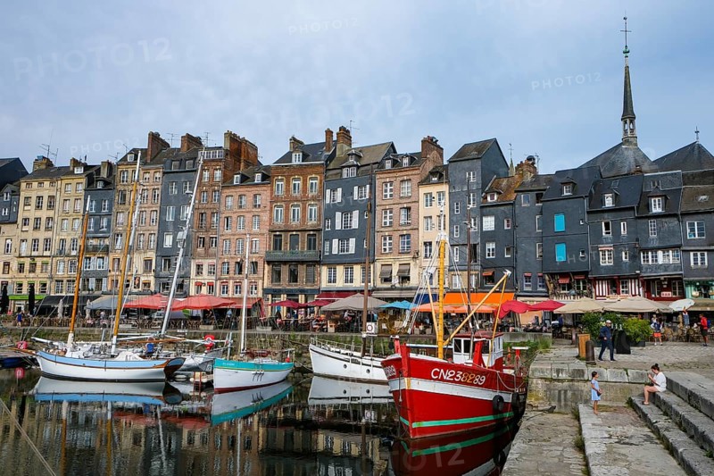 Honfleur, Normandy, France - Boats on the Quai Sainte-Catherine in the old harbour, Vieux Bassin, in the picturesque harbour town of Honfleur at the mouth of the Seine