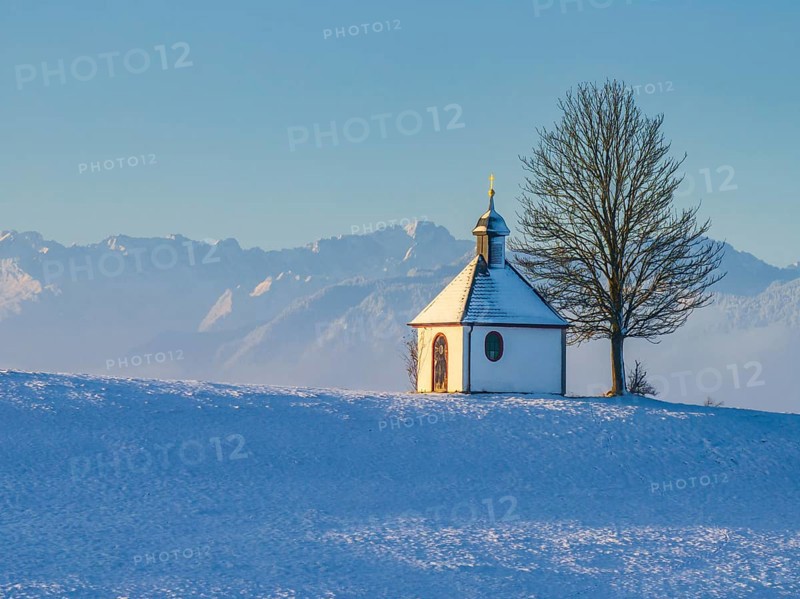 Chapel, tree, morning light, winter, snow, mountain landscape, near Riegsee, behind Zugspitze, Alpine foothills, Bavaria, Germany, Europe