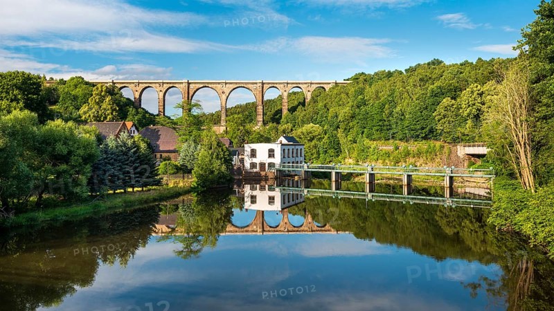 The Göhren Viaduct, railway bridge over the river Zwickauer Mulde with reflection, Wechselburg, Saxony, Germany, Europe