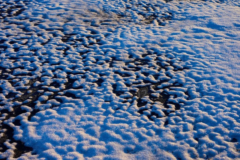 Frozen snow layer with irregular patterns in sunlight, winter, Wasserkuppe, Gersfeld, Rhön, Hesse, Germany, Europe