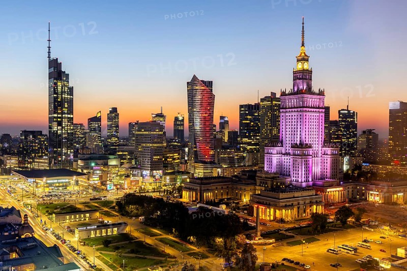 Warsaw skyline skyscrapers with Palace of Culture in the city centre at night in Warsaw, Poland, Europe