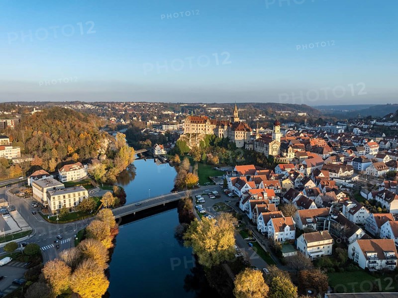 Aerial view of the town of Sigmaringen with the Hohenzollern Castle, a sight and tourist attraction above the old town and the Danube with autumnal vegetation, Danube valley, district of Sigmaringen, Baden-Württemberg, Germany, Europe