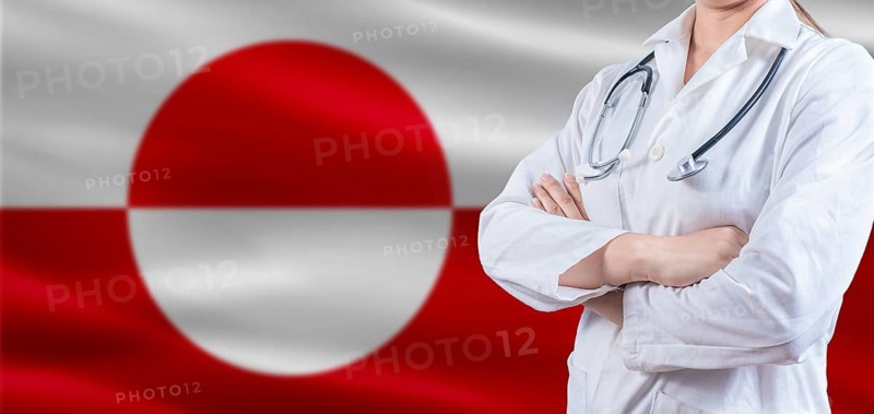 Doctor with crossed arms on Greenland flag. Greenland Health and Care concept. Female doctor on Greenland flag