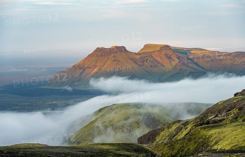 Fog between mountains, moss-covered volcanic mountain landscape, at sunset, Pakgil, Iceland, Europe