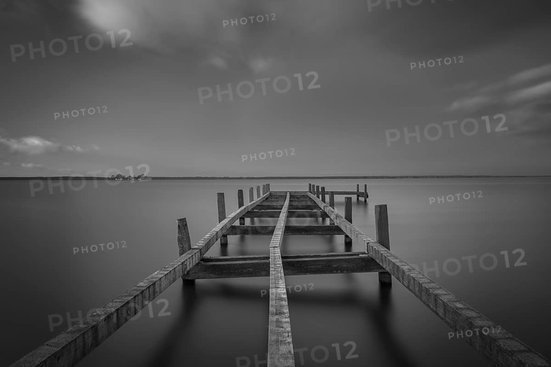 View of a partially dismantled jetty at Steinhuder Meer, Wilhelmstein, long exposure, black and white, black and white, lake, nature photo, landscape photography, moving clouds, landscape format, wood, Hagenburg Canal, Hagenburg, Hanover region, Lower Saxony, Germany, Europe