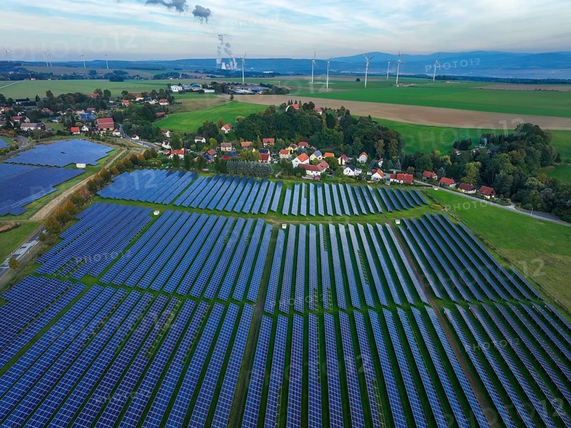 Zittau, Saxony, Germany, Oberseifersdorf solar field, solar park in Oberseifersdorf, in the municipality of Mittelherwigsdorf, behind wind turbines and the Turów lignite-fired power plant in Poland, Europe